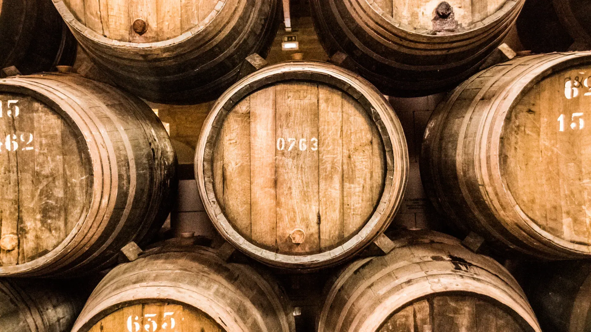 Seismic barrel-aged spirit bottles with mission tags