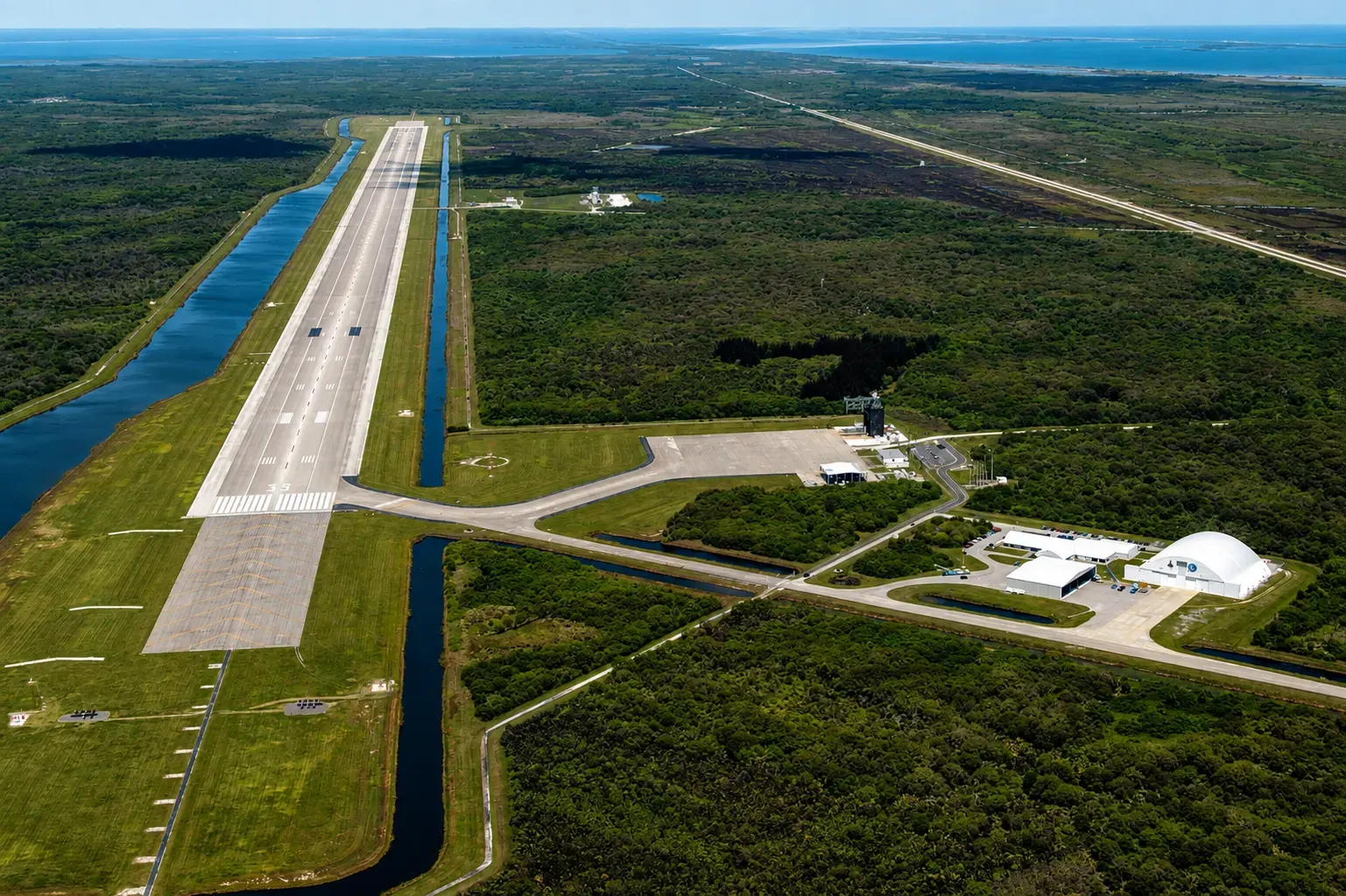 Aerial view of the 3-mile Shuttle Landing Facility runway at Kennedy Space Center